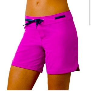 Prana women’s pink board shorts.